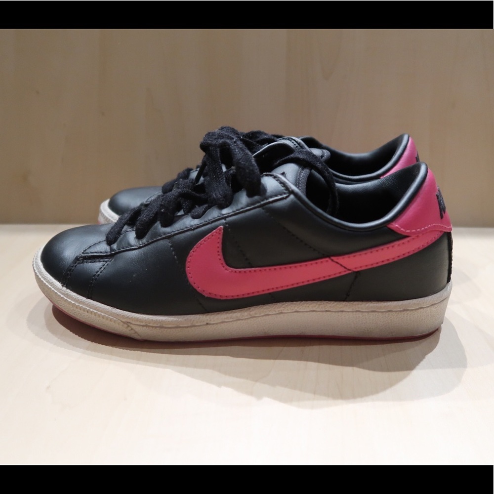 Nike black faux leather sneakers with pink swoosh